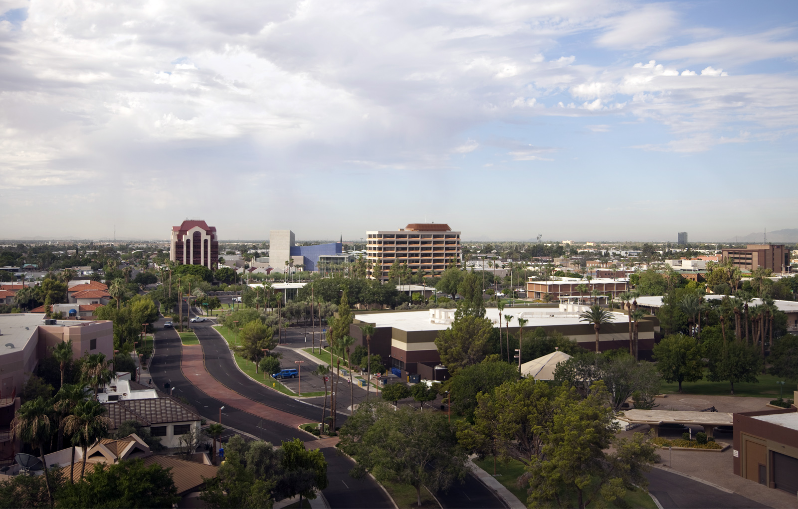 View from top floor of a high rise in Mesa Arizona. Looking southeast. Mesa Arts Center is modern blue building in center.  Panaorama view: